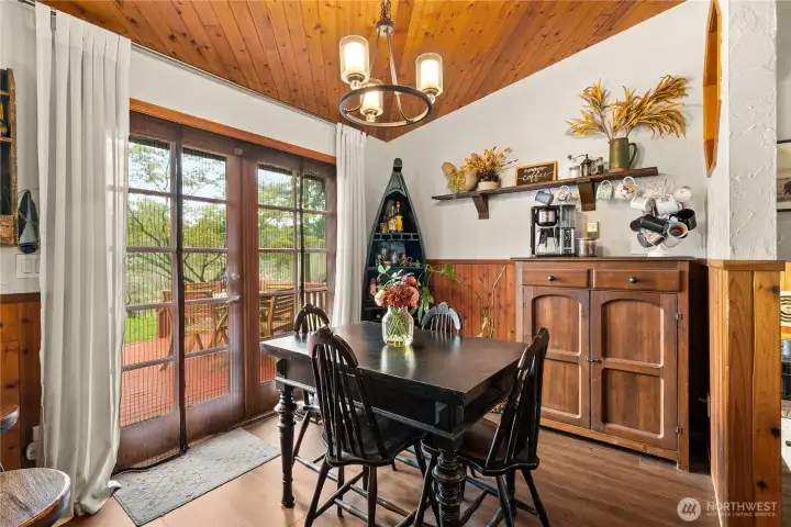 Dining room with french doors leading to the spacious deck.