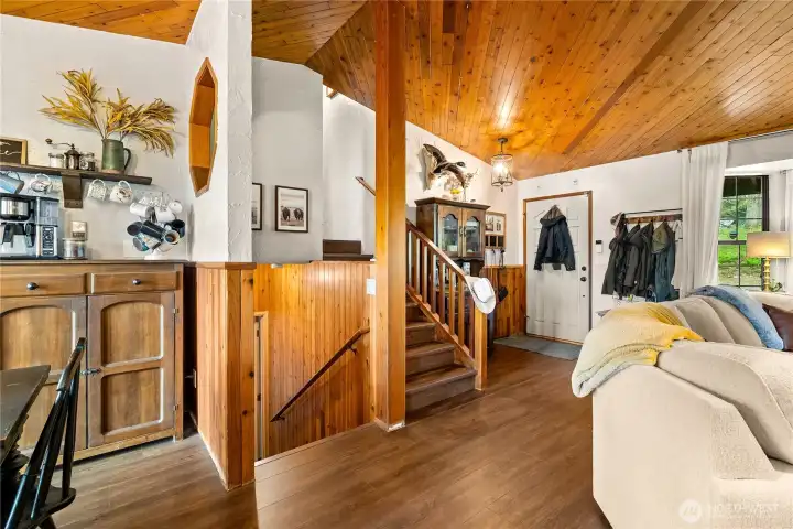 Head upstairs to the primary bedroom and two additional bedrooms.