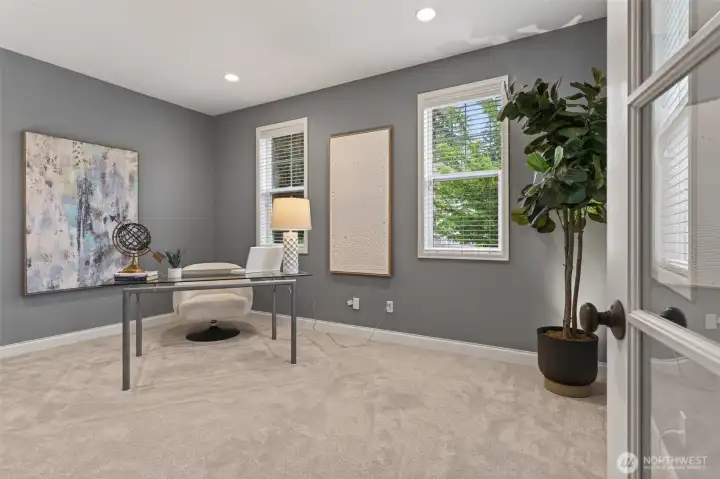Main floor office offers privacy and versatility.