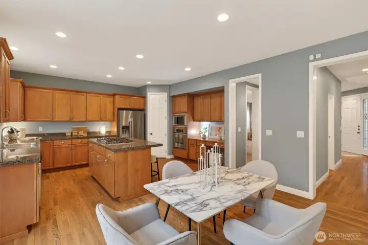 Gourmet kitchen with granite countertops and abundant prep space. Stainless steel appliances complement the stylish kitchen design.