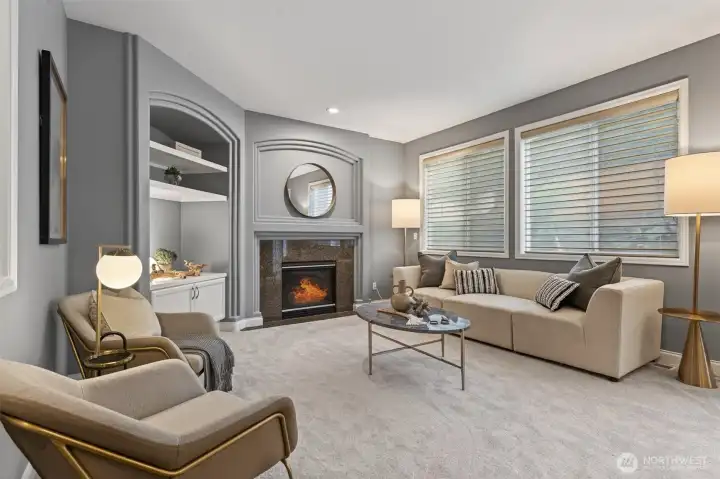 Comfortable family room invites relaxation and connection. A cozy fireplace creates warmth and ambiance year-round.