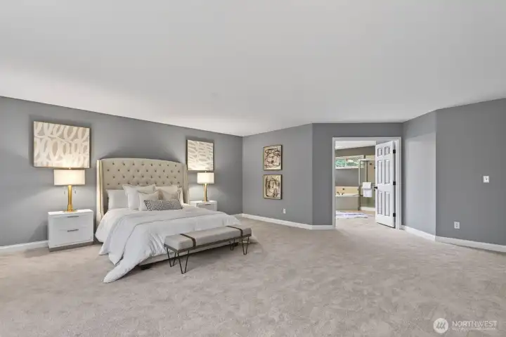 Luxurious primary suite offers a peaceful retreat.