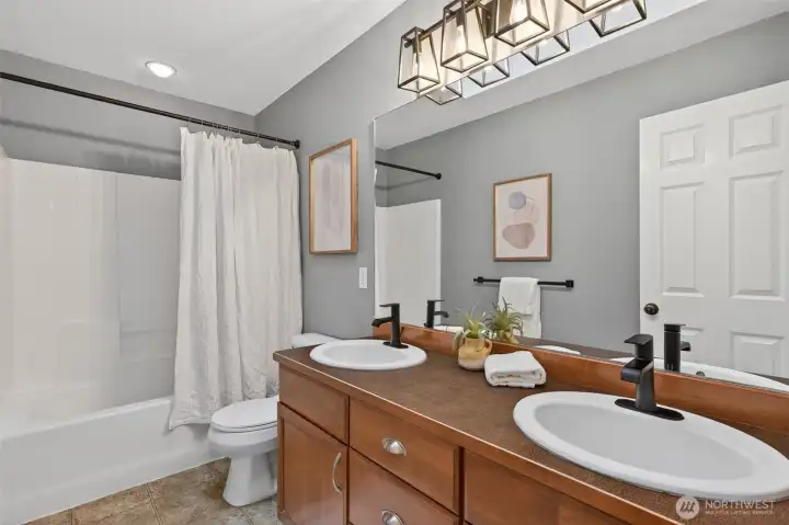 Full bath with tub/shower combo.