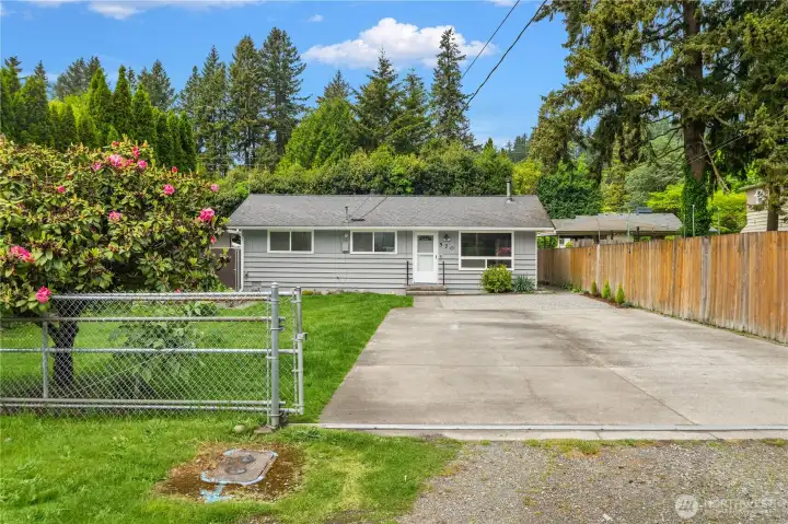huge front yard with lovely raised garden bed. There is plenty of space to add on and completely redo this home.