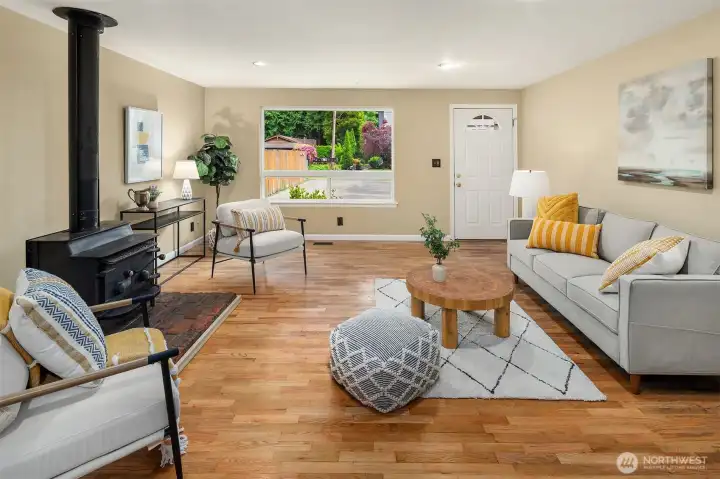 centered around a lovely wood burning fireplace the living room is light and inviting.