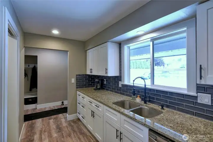 Granite counters and tile backsplash