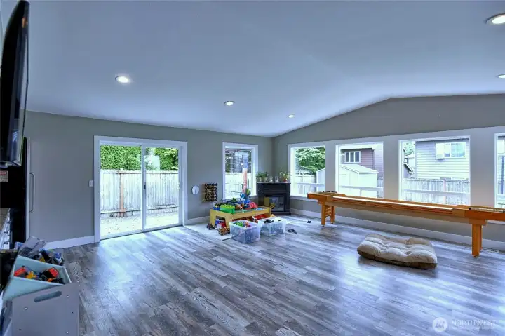 Bright bonus room with backyard access