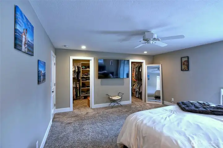 Primary bedroom with private bathroom and walk-in closet