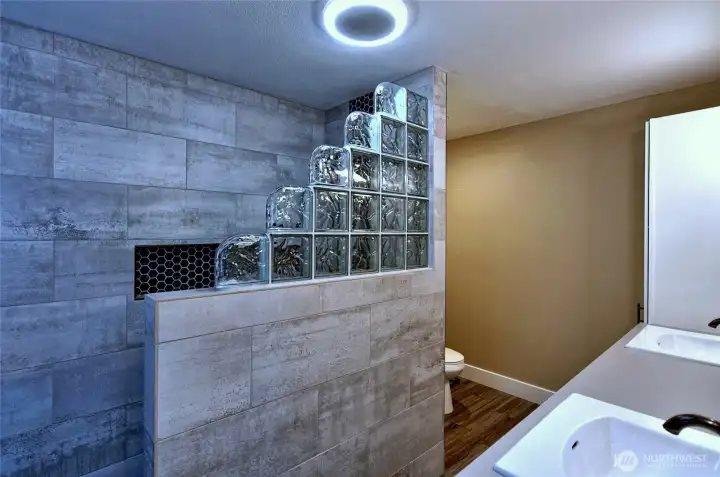 Primary bath with custom tiled shower