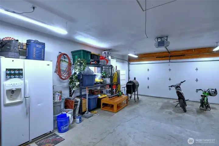 Attached garage with storage and workspace