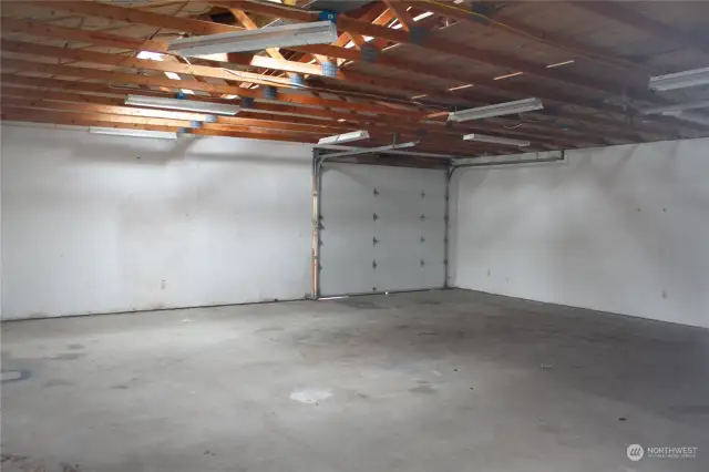 Interior of detached garage. 2nd door off rear is pictured.