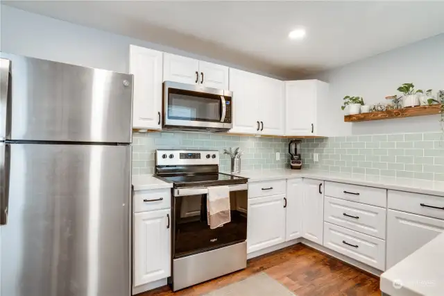 Completely new kitchen with appliances!  Lighting, open shelves and designer tiling!