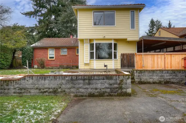 Entire home has a clay tile roof.