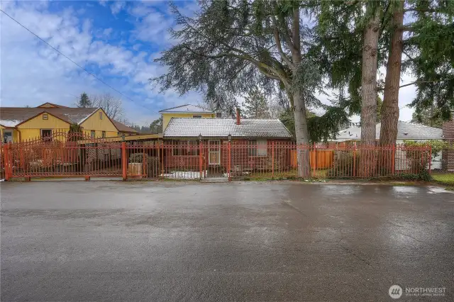 Cars enter to the left, friends and loved ones through the front gate.