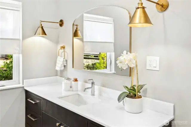 Thoughtful and high-end fixtures highlight the main floor bathroom.