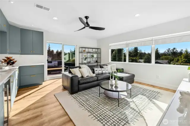 Heading upstairs you  find a wonderful game room/family room at the front of the house that enjoys great views and easy access to the sunny roof deck.