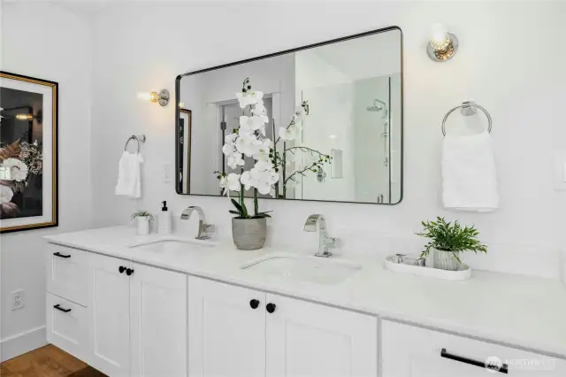 The primary bathroom with modern, high-end fixtures.