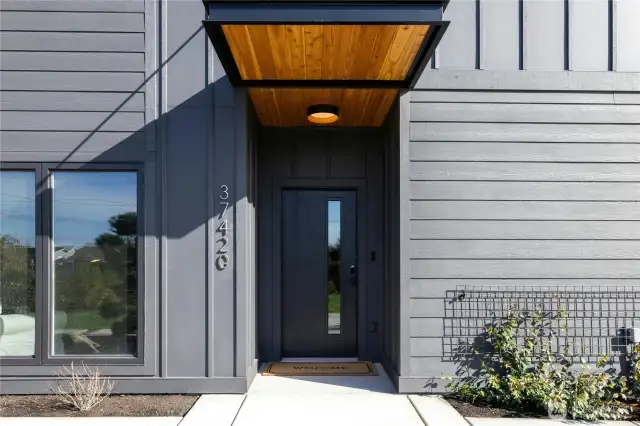 A convenient and practical covered front porch welcomes you home and greets your guests.