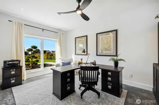 The main floor home office is a wonderful, flexible space with mountain views.