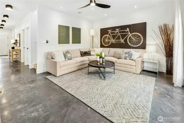 The spacious main floor living room opens out to the back yard and connects nicely to the kitchen too.