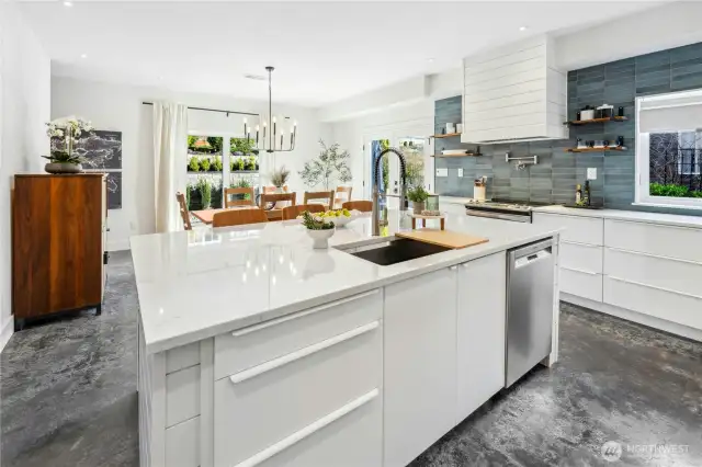 This sleek and attractive, open-concept kitchen is the heart of the home and has a wonderful and convenient, eat-in prep island.