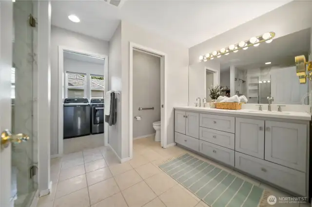 Primary Bathroom with doorway to laundry room