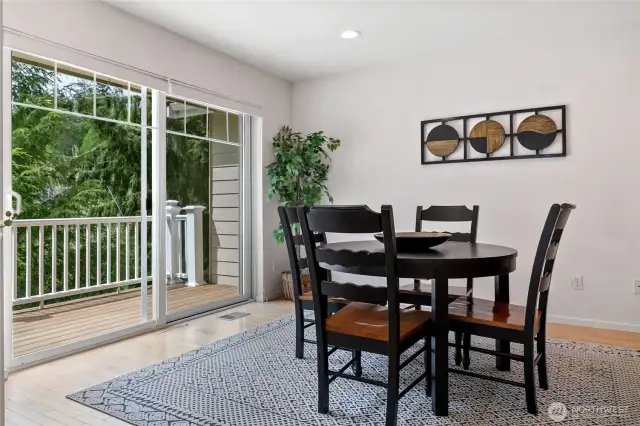 Kitchen eating area that brings in light from sliding unit.