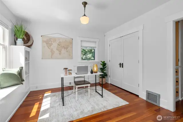 Bedroom on main level staged as an office