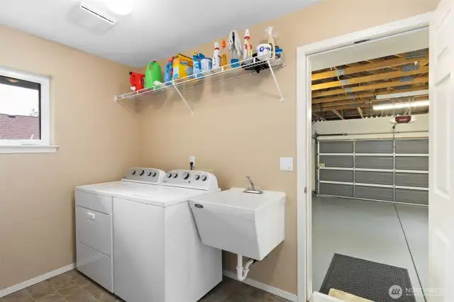 Spacious utility room with sink.