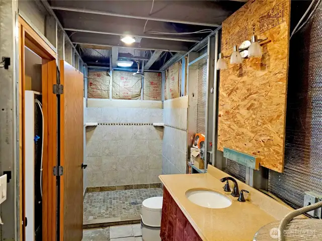 Bathroom is in with a composting toilet.