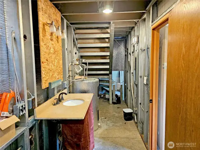 Storage space under the stairs.