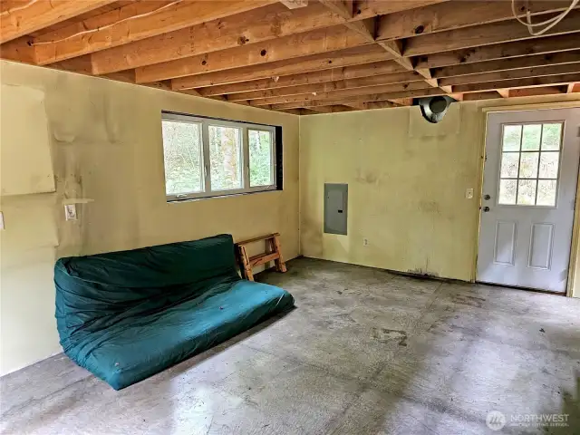 There was once a wood stove against the far wall here. It would need to be re-installed.