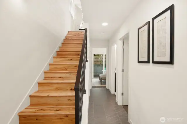 Entry hallway leading to additional bedrooms & backyard access