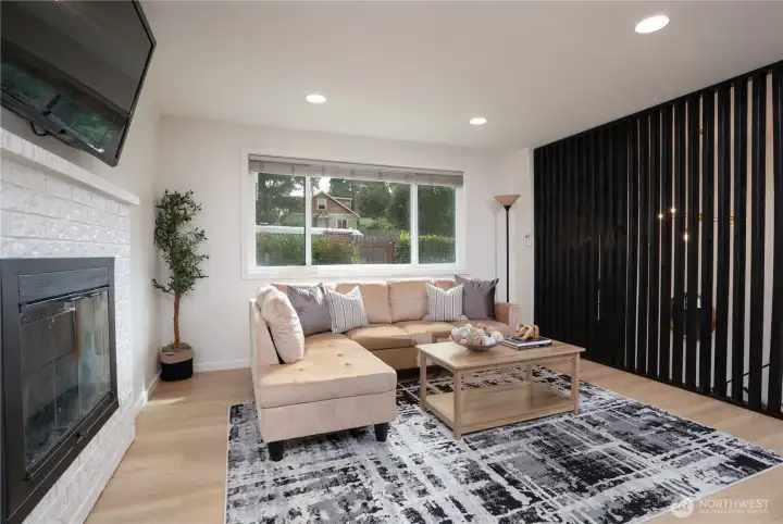 Bright living room with energy-efficient windows and bold custom wood accent wall.