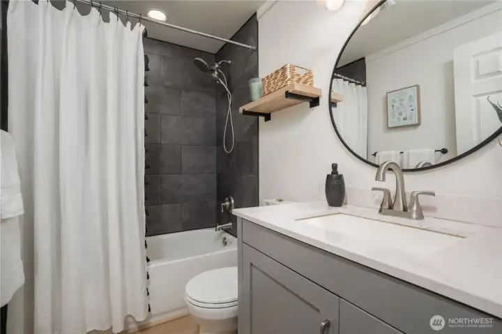 Stylish bathroom with sleek fixtures, modern tiles, and clean design. Updated in 2021.