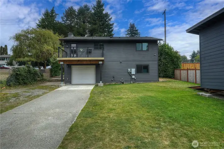 Ample parking space with a driveway and garage for convenience.