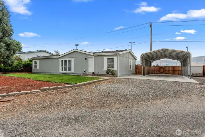 Side shot with a giant carport!