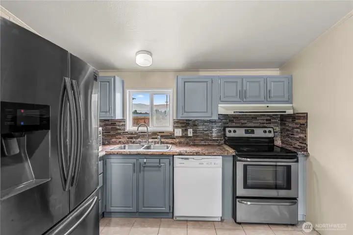 Kitchen with a window overlooking the backyard!