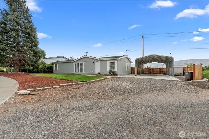 Side shot with a giant carport!