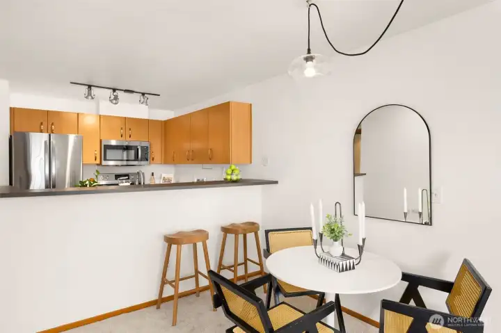Sweet dining area with chic updated pendant light fixture.
