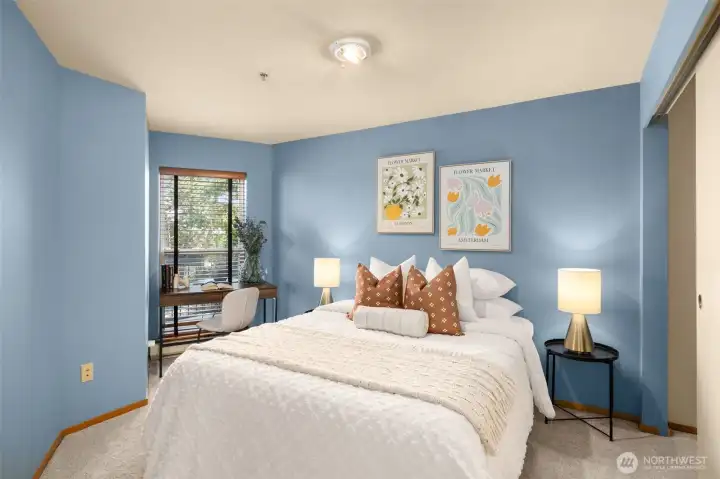 The spacious bedroom is designed for restful nights and lazy weekend mornings. Wake up to sunny vistas!