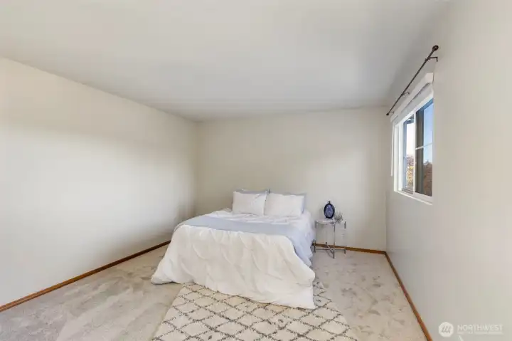 Spacious primary suite upstairs.
