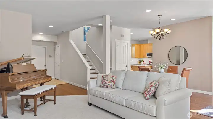 Main floor Formal Living Room and Dining Room. Including a Family Room (not shown) behind the Dining room wall.  Also showing the Garage Door and Entry Door.