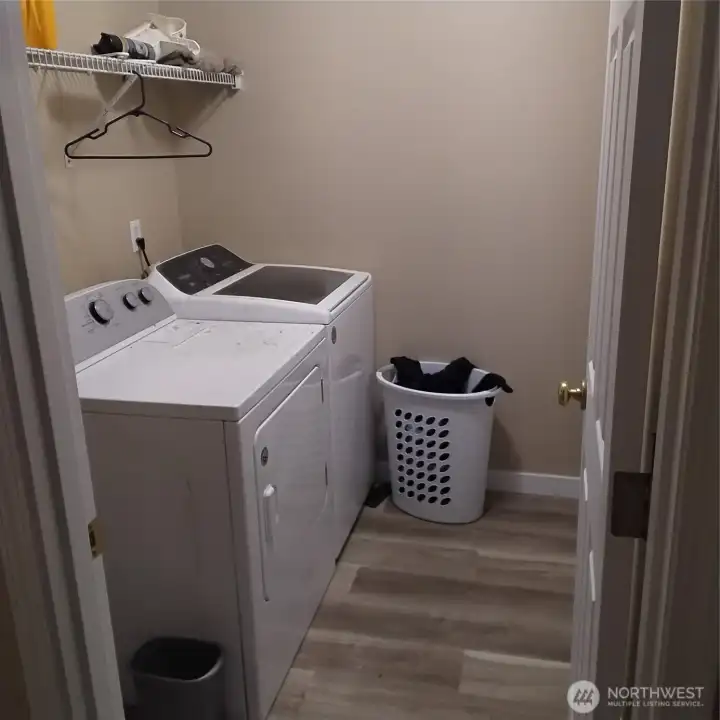 Laundry room with door to the garage.  Washer/Dryer stay