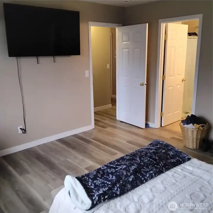 Main bedroom with door to the adjacent bathroom to the right.