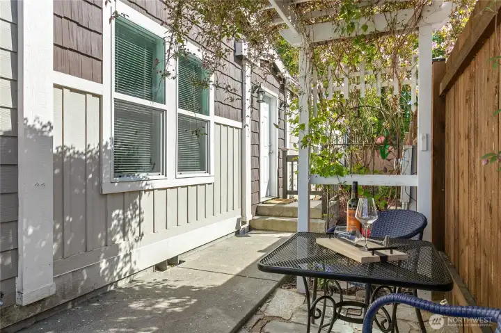Stunning clematis arch with quaint sitting area
