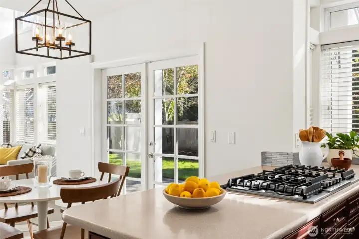 Disappearing range vent opens counter to experience Great Room