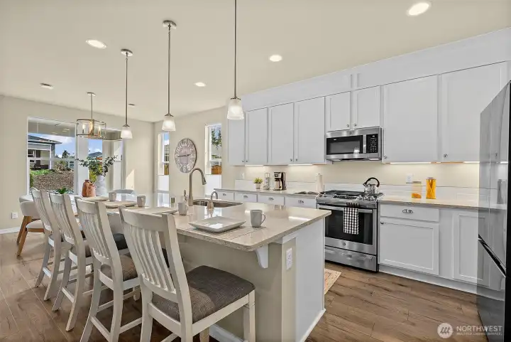 What a gorgeous kitchen! The oversized island offers great seating.