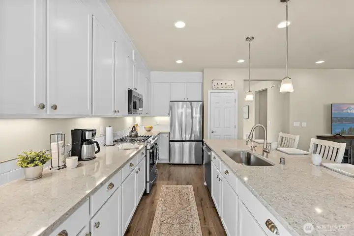 Gleaming Quartz counters and extended cabinetry with optimal storage