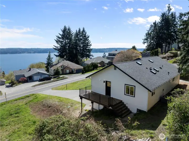 Elevated perspective highlighting the home’s proximity to water and scenic views.